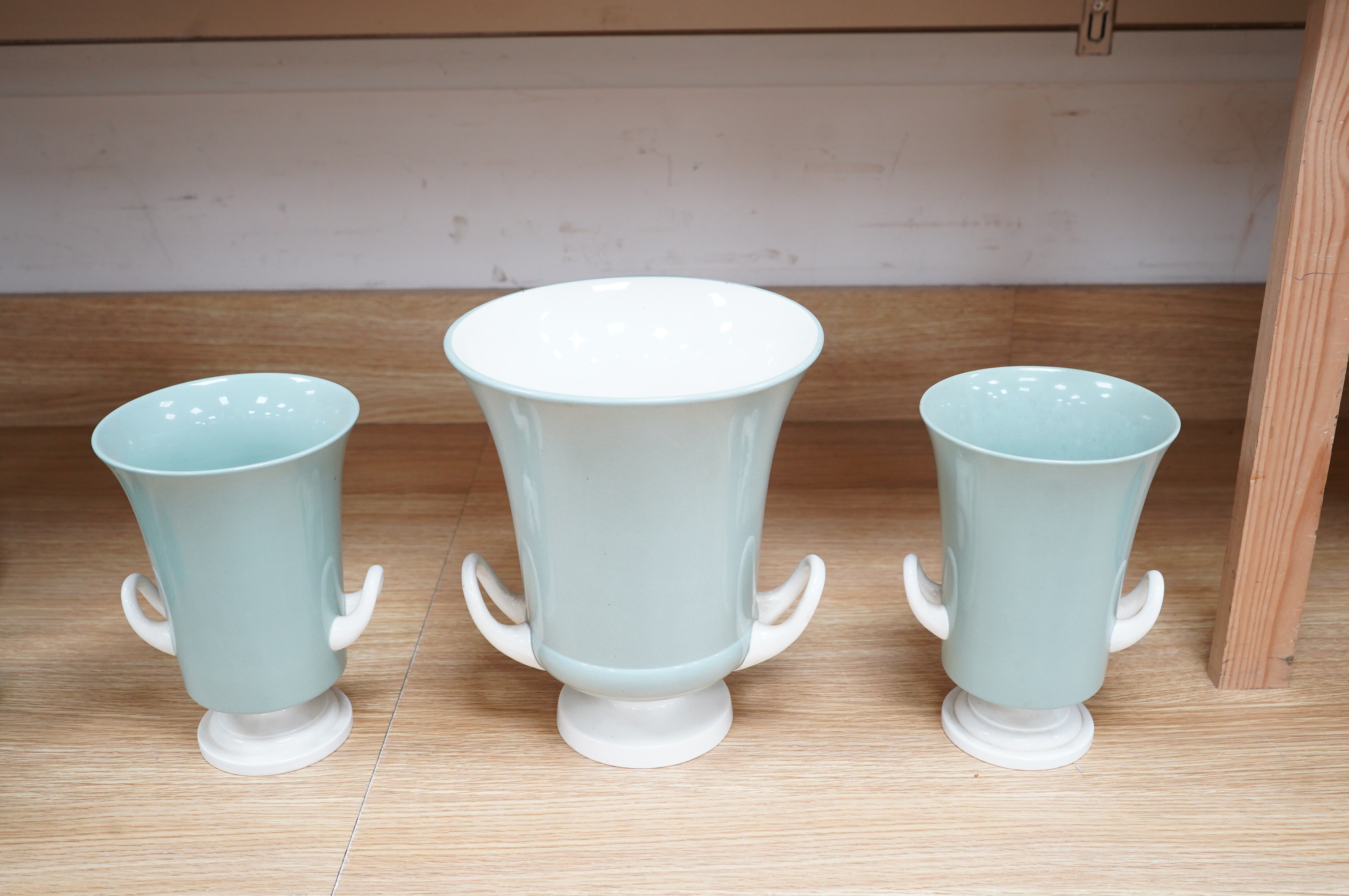 Keith Murray for Wedgwood, a garniture of three graduated twin handled slipware vases, stamped to the bases, largest 25cm high